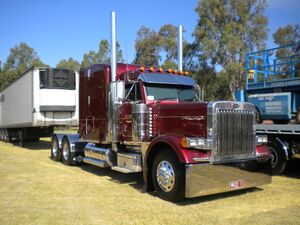 A red Peterbilt 379 big rig lorry.